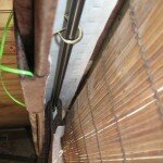 Curtain rod hung on cup hooks